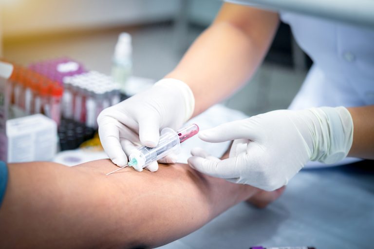 taking blood sample from a patient in the hospital